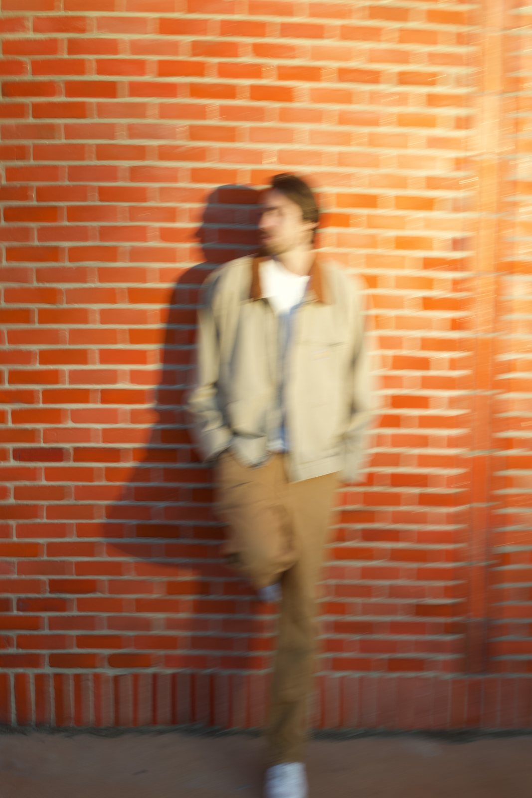 KY against a brick wall at golden hour